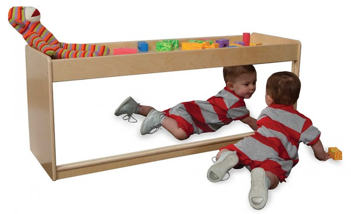  The  Infant Pull-Up Storage  serves as an infant pull-up, shelf storage in the back, and infant discovery center with a full-length shatterproof acrylic mirror. 